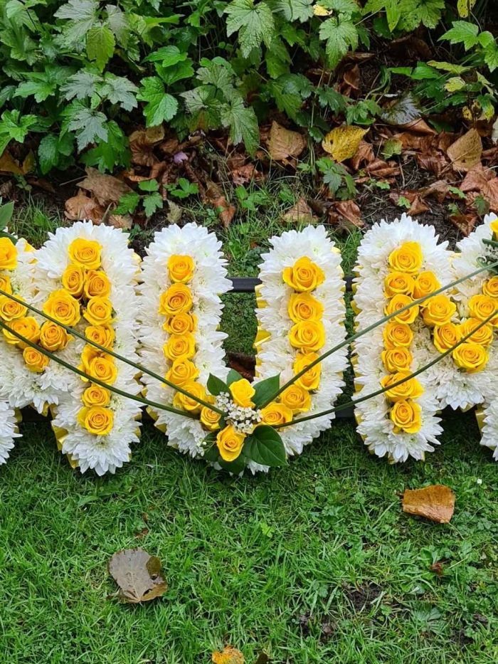 Floral letters with rose inset
